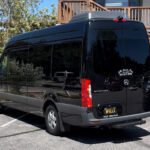 A black van parked in the parking lot