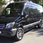 Black Mercedes Sprinter limo parked curbside